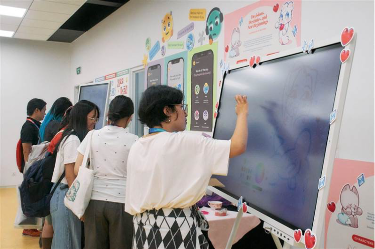 Visitors engage with the students’ showcased products