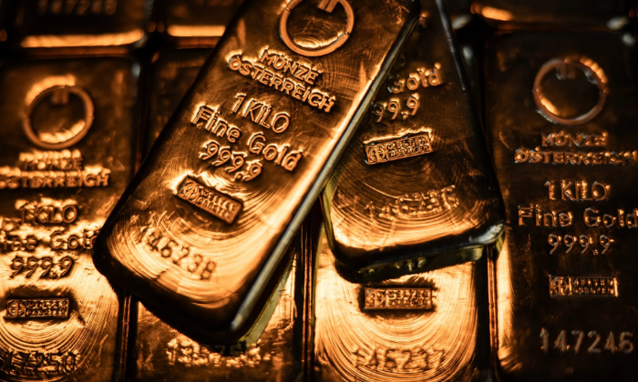 Giá vàng tăng mạnh, USD trượt dốc sau phát biểu của ông Powell
