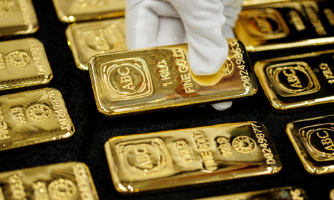 Vàng giảm giá vì đồng USD giữ đà tăng, SPDR Gold Trust bán ròng