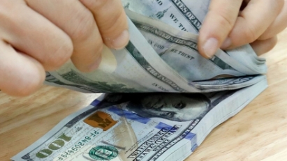 Lo ngại găm giữ ngoại tệ tạo áp lực lên tỷ giá