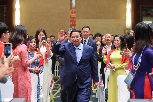 Thủ tướng Phạm Minh Chính gặp gỡ cộng đồng người Việt Nam tại Trung Quốc. Ảnh: VGP