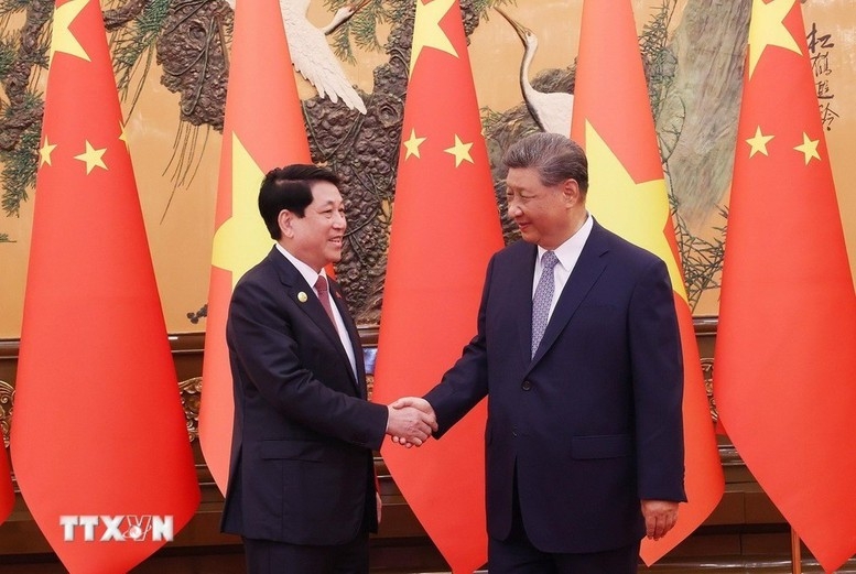 Chủ tịch nước Lương Cường gặp Tổng Bí thư, Chủ tịch Trung Quốc Tập Cận Bình. Ảnh: TTXVN.