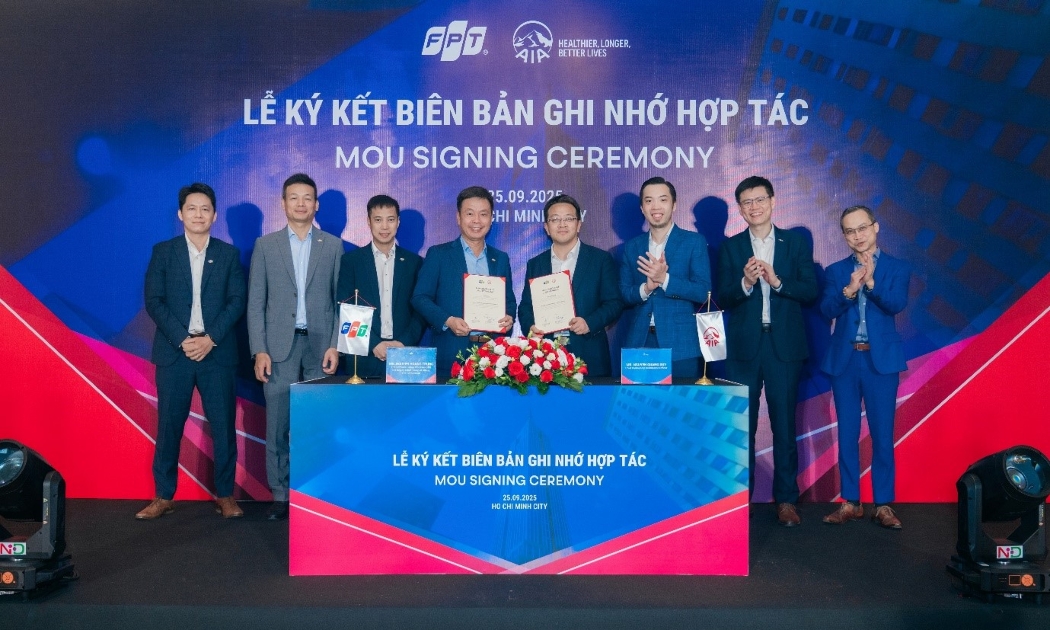 Đại diện AIA và FPT tại buổi lễ ký kết biên bản ghi nhớ hợp tác