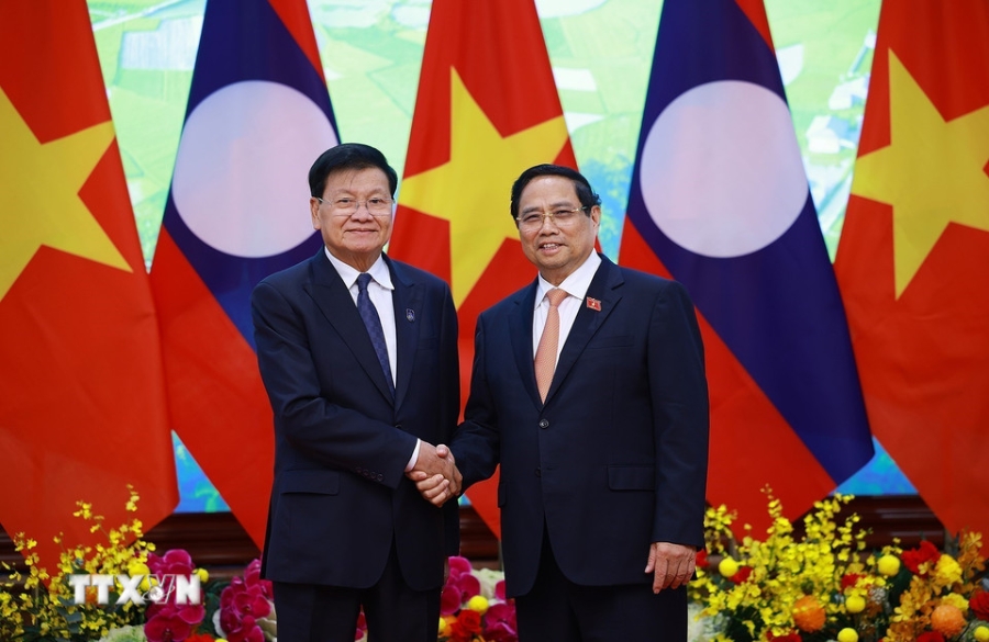 Thủ tướng Phạm Minh Chính hội kiến Tổng Bí thư, Chủ tịch nước Lào Thongloun Sisoulith. Ảnh: TTXVN