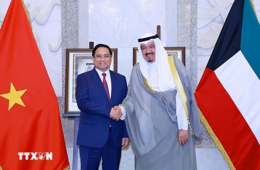 Thủ tướng Phạm Minh Chính và Thủ tướng Nhà nước Kuwait Sheikh Ahmad Abdullah Al-Ahmad Al Sabah. Ảnh: TTXVN.