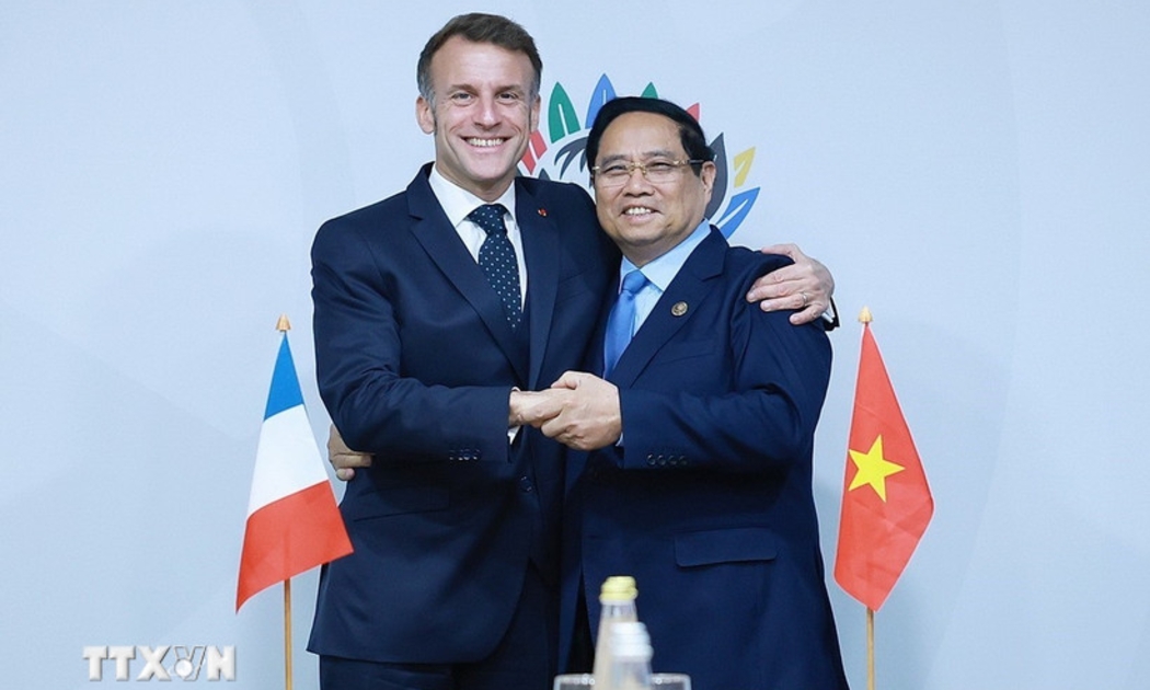 Thủ tướng Phạm Minh Chính gặp Tổng thống Pháp Emmanuel Macron. Ảnh: TTXVN.