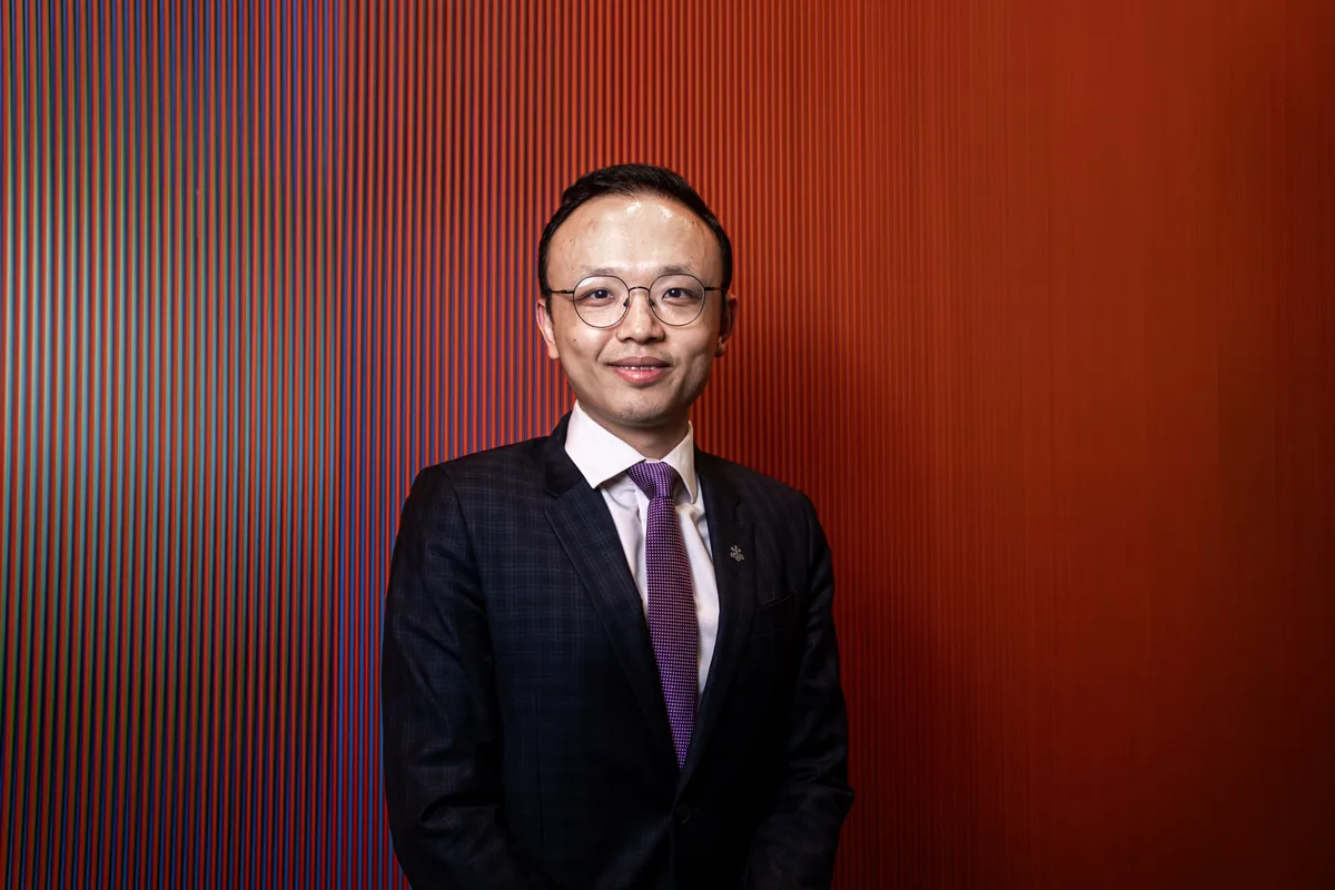 Chuyên gia John Lam của UBS - Ảnh: Bloomberg.