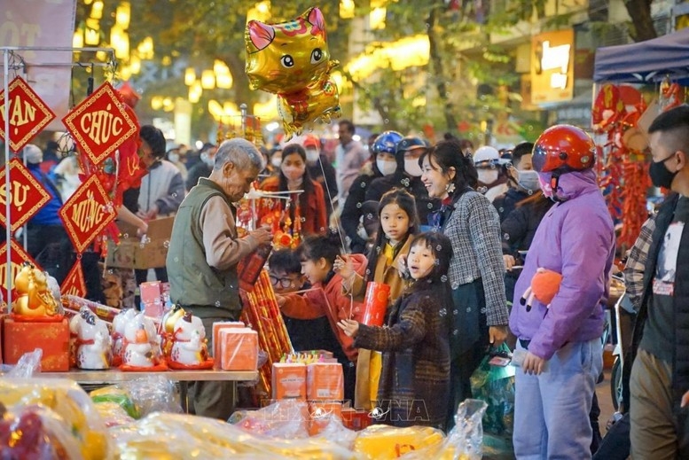 Cả nước đón Tết, vui Xuân với tinh thần "ăn Tết gọn, làm việc sớm, vào việc ngay" - Ảnh minh họa: TTXVN