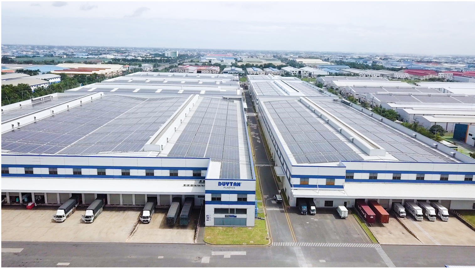 The existing Duy Tan Long An Factory, featuring a rooftop solar power system.